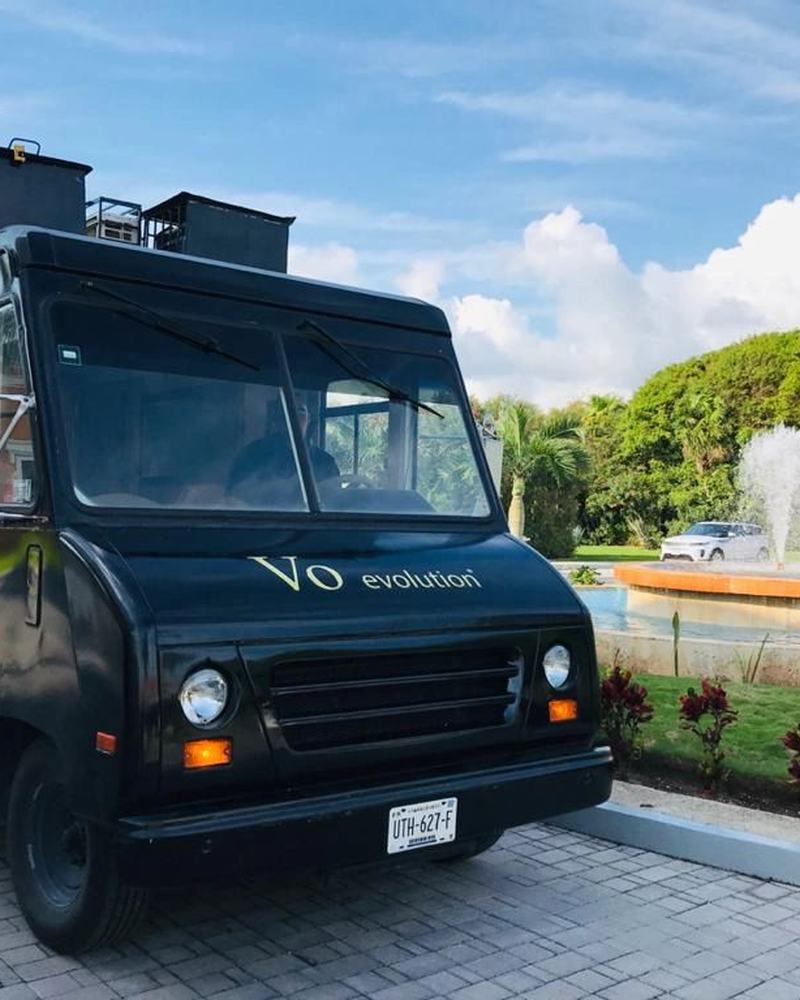 The black Beauty Truck parked at a resort entrance