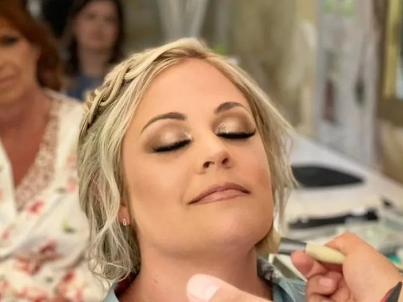 Airbrush makeup being applied to a bride